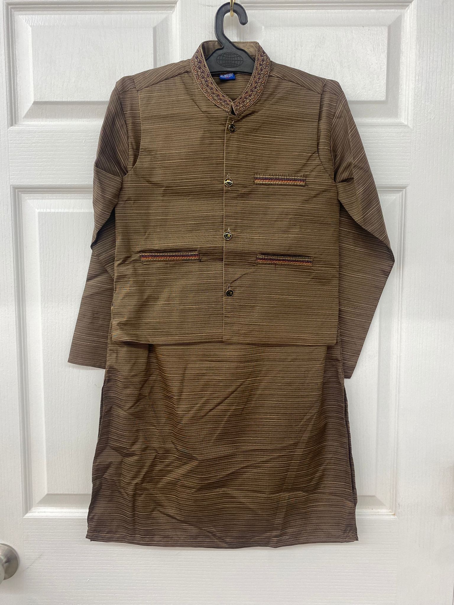 Olive green salwar kameez with waist coat.