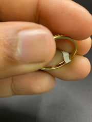 18KT gold drop shaped ring with diamonds