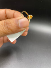 18KT gold drop shaped ring with diamonds