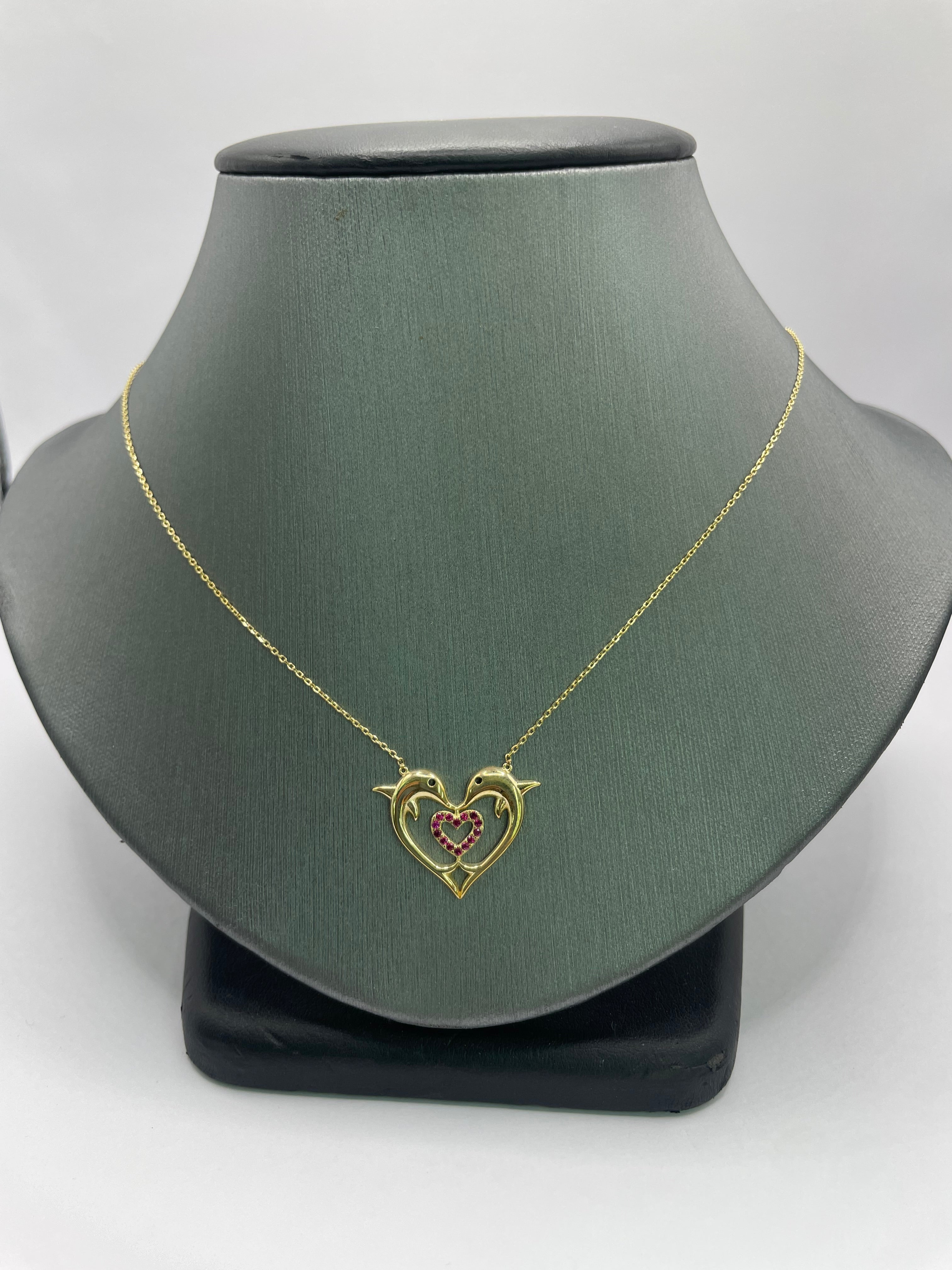10Kt gold necklace dolphins